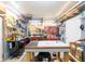 Well-lit workshop provides a functional space with ample tools, shelving, and workbench areas for creative projects at 7984 S Deer Lake Dr, Nineveh, IN 46164