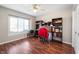 Bright bedroom with laminate floors and ample natural light, featuring neutral walls at 946 Peppermill Run, Greenwood, IN 46143