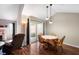 Inviting dining room with vaulted ceiling, table, and a nearby living room area at 946 Peppermill Run, Greenwood, IN 46143