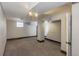Unfinished basement with white walls and spotlights, ready for customization at 952 E 34Th St, Indianapolis, IN 46205