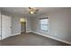 This bedroom features a ceiling fan, closet, plush carpeting, and neutral paint to accommodate any decor at 952 E 34Th St, Indianapolis, IN 46205
