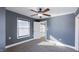 This bedroom features a ceiling fan, a closet, and a window to let in plenty of natural light at 952 E 34Th St, Indianapolis, IN 46205