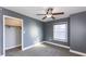 This spacious bedroom has a ceiling fan and a closet for storage and is neutrally painted to accommodate any decor at 952 E 34Th St, Indianapolis, IN 46205