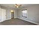 Bedroom features carpeted floors, natural light, and closet at 952 E 34Th St, Indianapolis, IN 46205