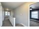 This hallway on the second floor leads to the bedrooms, and is naturally lit by the windows at the end at 952 E 34Th St, Indianapolis, IN 46205
