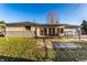 Spacious backyard with a patio, outdoor furniture, and a fenced area, perfect for relaxation and entertainment at 9619 E Southport Rd, Indianapolis, IN 46259