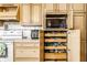 Custom kitchen cabinets with built-in microwave and storage at 9619 E Southport Rd, Indianapolis, IN 46259