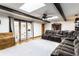 Comfortable living room with exposed beams, recessed lighting, a ceiling fan, and hardwood floors at 9619 E Southport Rd, Indianapolis, IN 46259
