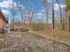 Expansive backyard featuring mature trees, a wooden deck, and plenty of room to roam at 108 Parkridge Dr, Danville, IN 46122