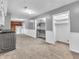 Spacious basement with grey walls, carpeted floor, and closets for storage at 108 Parkridge Dr, Danville, IN 46122