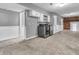 Basement laundry room with grey walls, white wainscoting, and newer washer and dryer at 108 Parkridge Dr, Danville, IN 46122