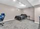 Finished basement featuring a bedroom with a black bed and a side table at 108 Parkridge Dr, Danville, IN 46122