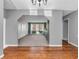 Open-concept layout showcasing hardwood floors leading into a dining room with built-ins and natural light at 108 Parkridge Dr, Danville, IN 46122