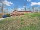Brick home on a spacious lot, showcasing the natural setting and convenient parking in a serene neighborhood at 108 Parkridge Dr, Danville, IN 46122