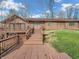 A charming brick home featuring a spacious deck and inviting entryway, blending rustic charm with modern appeal at 108 Parkridge Dr, Danville, IN 46122