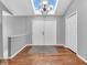 Bright foyer featuring wood floors, a skylight, and white double doors, offering a grand entrance to the home at 108 Parkridge Dr, Danville, IN 46122