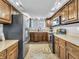 Functional kitchen featuring stainless steel appliances, tile floors, and ample counter space at 108 Parkridge Dr, Danville, IN 46122