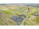 High angle view features a golf course community with abundant parking and club house at 1120 Constitution Dr, Edinburgh, IN 46124