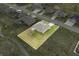 Aerial view of a brick home with a green lawn and a white property outline in a residential neighborhood at 1120 Constitution Dr, Edinburgh, IN 46124