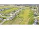 Scenic aerial view of a golf community neighborhood with lush lawns and winding street layout at 1120 Constitution Dr, Edinburgh, IN 46124
