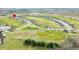 Aerial view of a residential neighborhood integrated with a golf course, promoting a serene and active lifestyle at 1120 Constitution Dr, Edinburgh, IN 46124