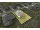 A serene aerial view of a brick home surrounded by a lush green lawn, offering a tranquil residential setting at 1120 Constitution Dr, Edinburgh, IN 46124