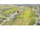 Scenic aerial view of a golf community neighborhood with lush lawns and winding street layout at 1120 Constitution Dr, Edinburgh, IN 46124
