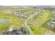 Enjoy breathtaking aerial view of a golf course community surrounding a tranquil pond at 1120 Constitution Dr, Edinburgh, IN 46124