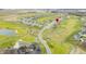 Enjoy breathtaking aerial view of a golf course community surrounding a tranquil pond at 1120 Constitution Dr, Edinburgh, IN 46124