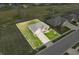 Aerial view of a brick home with a green lawn and a white property outline in a residential neighborhood at 1120 Constitution Dr, Edinburgh, IN 46124