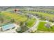 An expansive aerial view of a residential community, showcasing homes nestled among golf courses and green spaces at 1120 Constitution Dr, Edinburgh, IN 46124