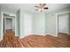 Bedroom featuring sleek wood floors, natural light, ensuite bathroom and generous closet space at 1120 Constitution Dr, Edinburgh, IN 46124