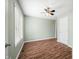 Inviting bedroom with sleek hard floors, natural light, and modern ceiling fan at 1120 Constitution Dr, Edinburgh, IN 46124