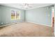 Bright, carpeted bedroom featuring a large window for natural light and neutral paint at 1120 Constitution Dr, Edinburgh, IN 46124