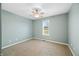 This bedroom has green walls, a ceiling fan and a single window at 1120 Constitution Dr, Edinburgh, IN 46124