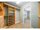 Organized walk-in closet with custom shelves, drawers, and open hanging space at 1120 Constitution Dr, Edinburgh, IN 46124