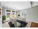 Charming dining area featuring a glass table, seating for six, and a view to the backyard at 1120 Constitution Dr, Edinburgh, IN 46124