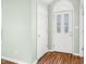 Inviting entryway featuring a decorative front door and beautiful hardwood floors at 1120 Constitution Dr, Edinburgh, IN 46124
