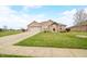 Charming brick home featuring a two-car garage and beautifully landscaped front yard at 1120 Constitution Dr, Edinburgh, IN 46124