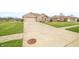 Charming brick home featuring a two-car garage and beautifully landscaped front yard at 1120 Constitution Dr, Edinburgh, IN 46124