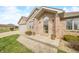 Charming brick home featuring a quaint front porch and manicured landscaping at 1120 Constitution Dr, Edinburgh, IN 46124