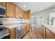 Eat-in kitchen is spacious and well-lit with stainless appliances and wood flooring at 1120 Constitution Dr, Edinburgh, IN 46124