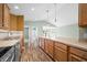 Well-lit kitchen features a large island, stainless steel appliances, and wood flooring at 1120 Constitution Dr, Edinburgh, IN 46124