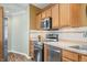 Modern kitchen features stainless steel appliances, ample counter space, and wooden cabinets at 1120 Constitution Dr, Edinburgh, IN 46124