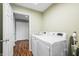 Laundry room includes a washer, dryer, and ample space for storage and organization at 1120 Constitution Dr, Edinburgh, IN 46124