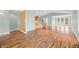 Spacious living room with beautiful hardwood floors and an open layout to the kitchen at 1120 Constitution Dr, Edinburgh, IN 46124
