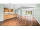 Open-concept living space with hardwood floors, a kitchen island, and plenty of natural light at 1120 Constitution Dr, Edinburgh, IN 46124