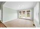 Spacious sunroom features tile flooring, neutral paint, and access to an outdoor area at 1120 Constitution Dr, Edinburgh, IN 46124