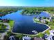 Breathtaking aerial view showcasing the community's beautiful homes surrounding the tranquil lake at 11967 Windpointe Pass, Carmel, IN 46033
