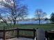 Enjoy a beautiful backyard with a lake view from a private deck with a charming chair at 11967 Windpointe Pass, Carmel, IN 46033